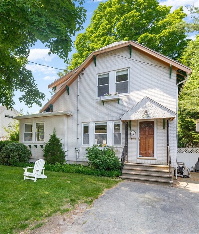 102 Gleason Road Lexington, MA 02420 - Photo 2 of 37 a front view of house with yard and green space