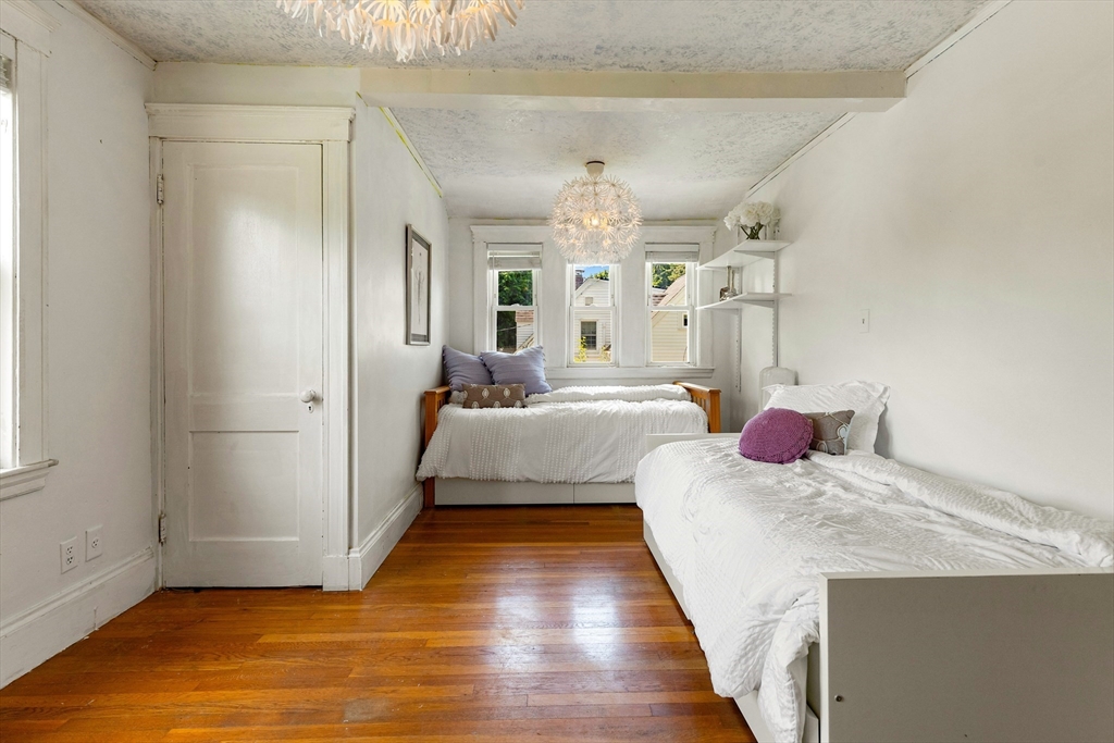 102 Gleason Road Lexington, MA 02420 - Photo 24 of 37 a bedroom with a bed and a large window