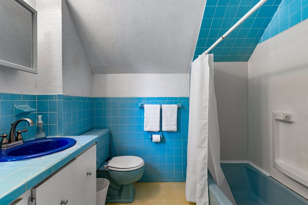 102 Gleason Road Lexington, MA 02420 - Photo 27 of 37 a bathroom with a toilet and a sink