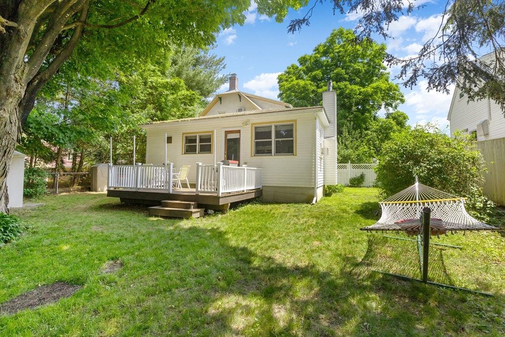 102 Gleason Road Lexington, MA 02420 - Photo 30 of 37 a view of a house with backyard and a tree