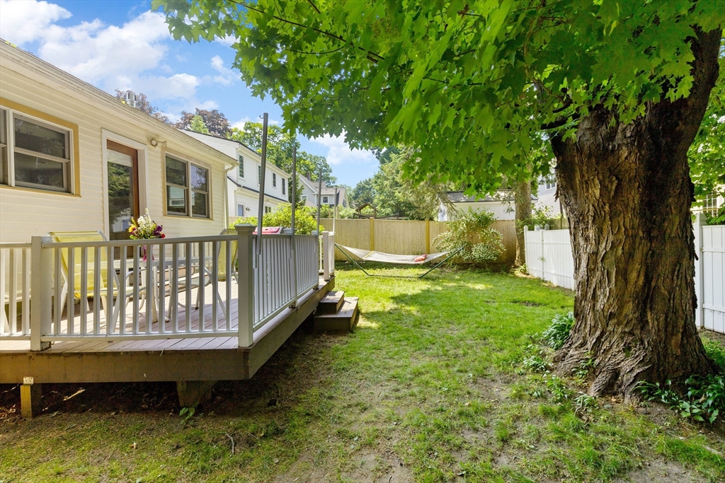 102 Gleason Road Lexington, MA 02420 - Photo 32 of 37 a backyard of a house with outdoor seating