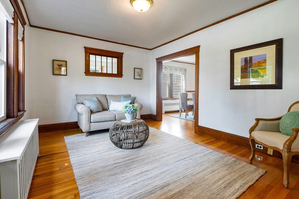 102 Gleason Road Lexington, MA 02420 - Photo 4 of 37 a living room with furniture and wooden floor