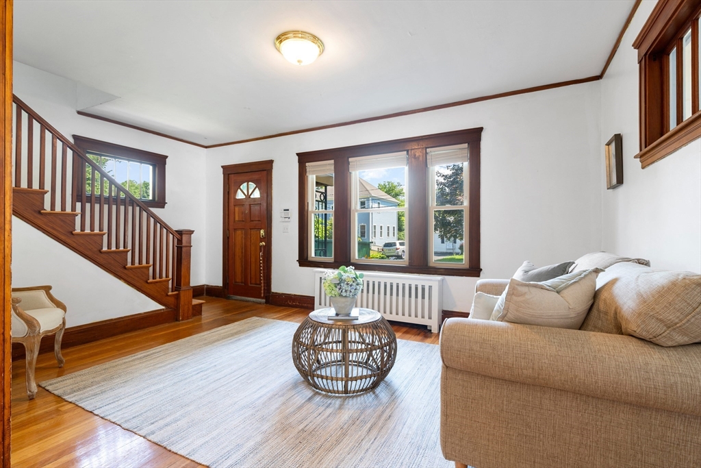 102 Gleason Road Lexington, MA 02420 - Photo 5 of 37 a living room with furniture and wooden floor