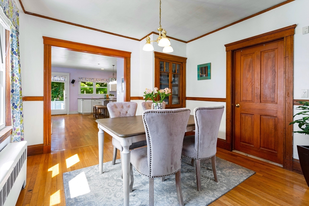 102 Gleason Road Lexington, MA 02420 - Photo 8 of 37 a view of a dining room with furniture window and wooden floor