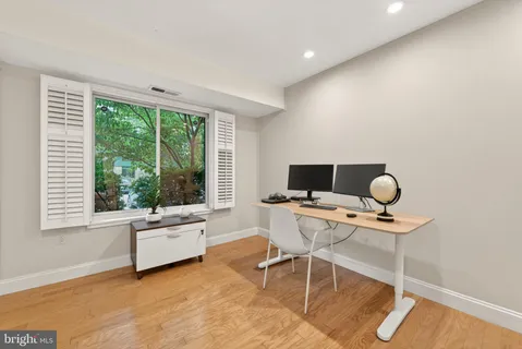 a workspace with furniture and a window