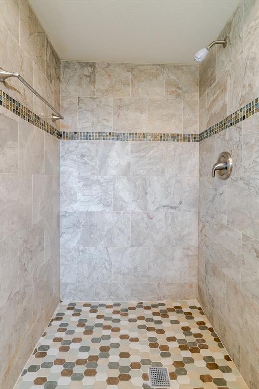 8918 134th Street North Seminole, FL 33776 - Photo 14 of 37 a bathroom with a shower