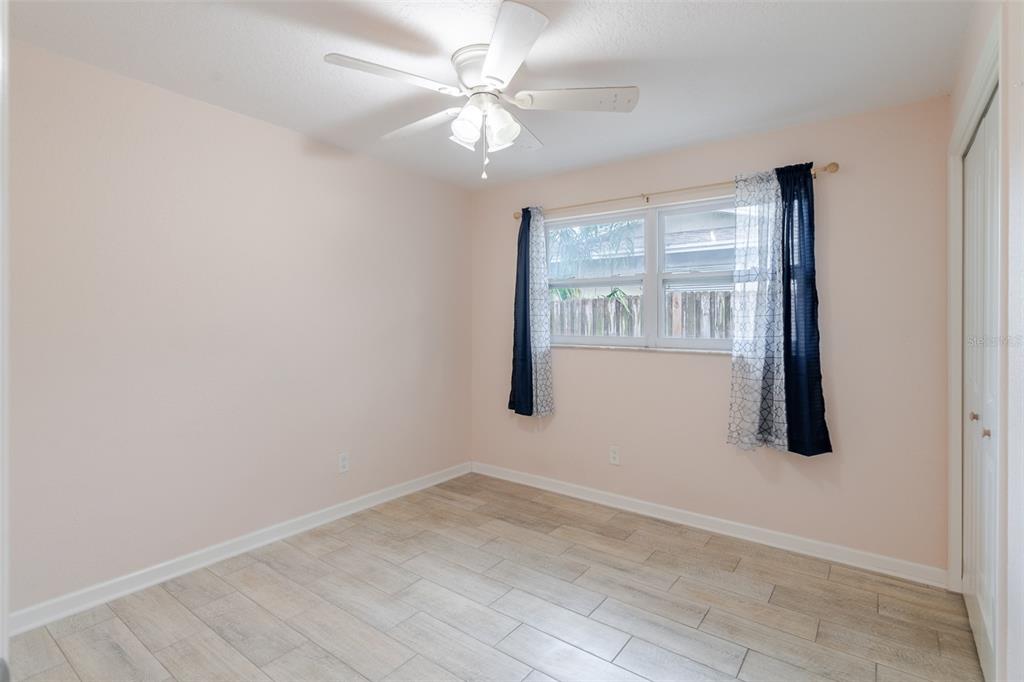 8918 134th Street North Seminole, FL 33776 - Photo 26 of 37 an empty room with windows and fan