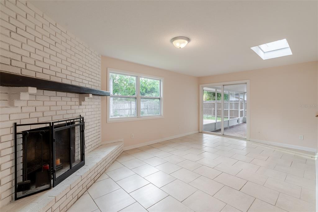 8918 134th Street North Seminole, FL 33776 - Photo 30 of 37 an empty room with windows and fireplace