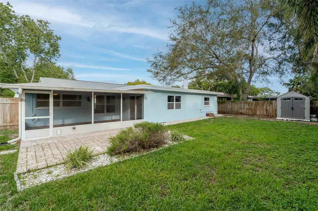 8918 134th Street North Seminole, FL 33776 - Photo 37 of 37 a view of a house with a back yard