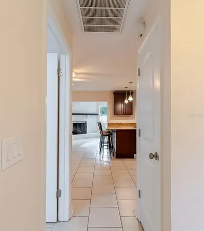 a kitchen with stainless steel appliances kitchen island granite countertop a refrigerator and a stove