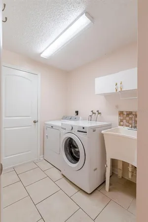 a utility room with dryer and washer