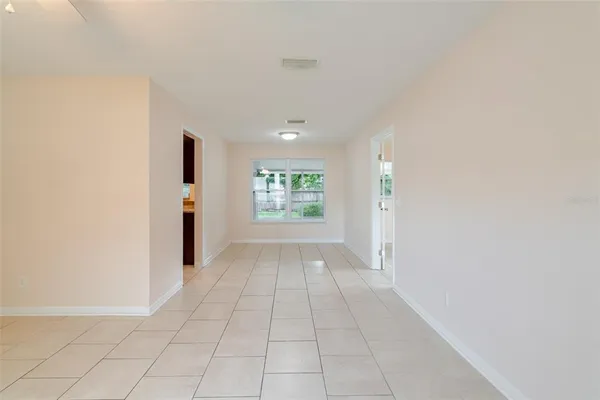 a view of an empty room with a window
