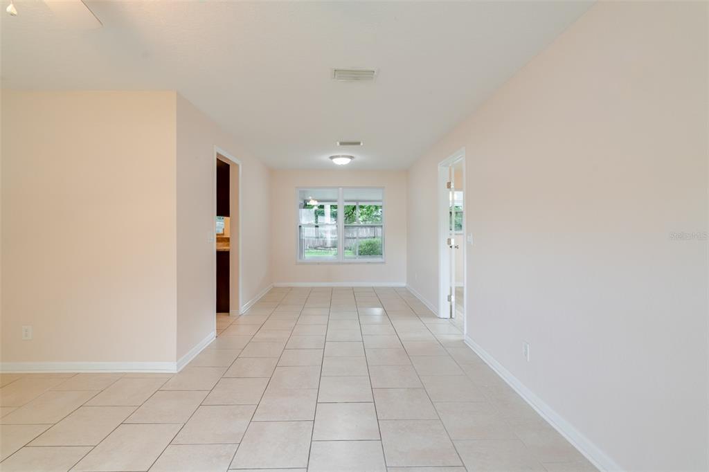 8918 134th Street North Seminole, FL 33776 - Photo 9 of 37 a view of an empty room with a window