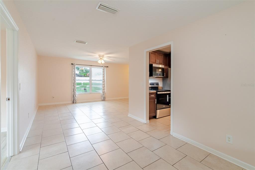8918 134th Street North Seminole, FL 33776 - Photo 10 of 37 a view of a kitchen with a sink and a refrigerator