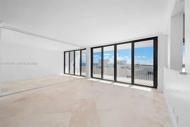 a view of an empty room with a balcony