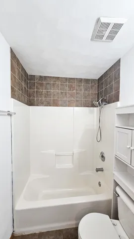 a bathroom with a sink a toilet and vanity