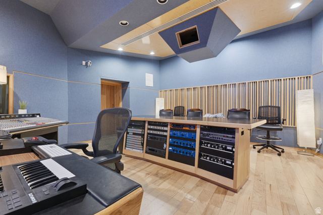 702 Alpine Highway Alpine, UT 84004 - Photo 71 of 83 Dedicated studio space featuring acoustic paneling on walls and ceiling, wood-finish flooring, recessed lighting, a built-in sound mixing desk with integrated equipment racks, and a wood slat acoustic wall treatment