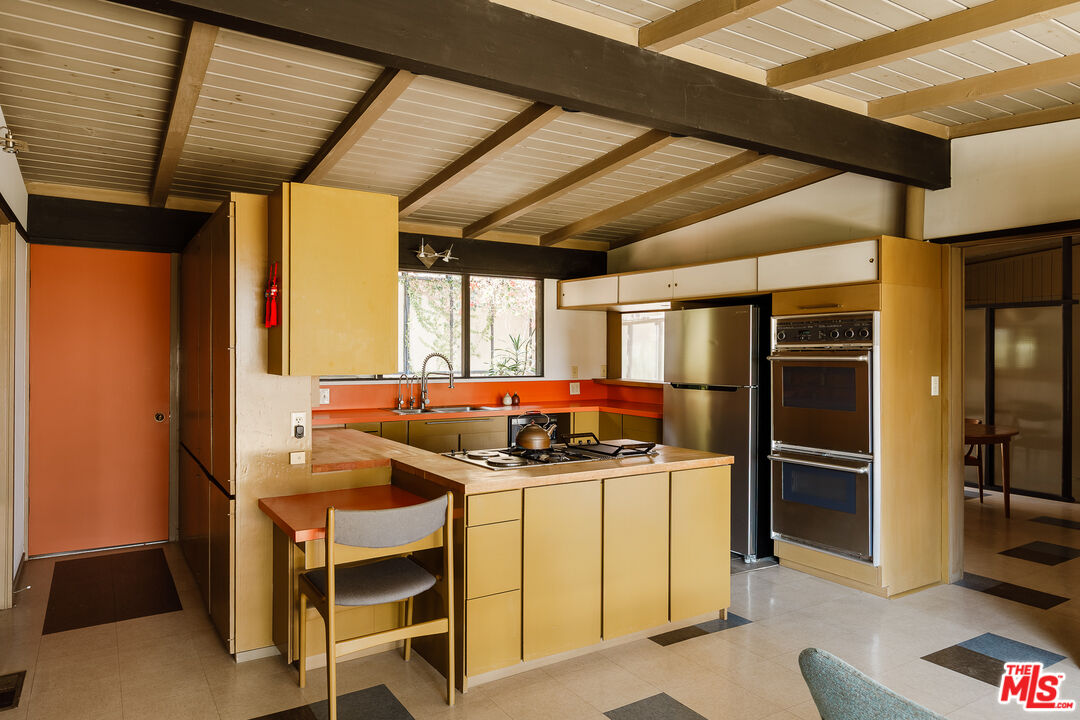 2 Seahurst Road Rolling Hills Estates, CA 90274 - Photo 23 of 54 a kitchen with stainless steel appliances granite countertop a sink a stove and refrigerator