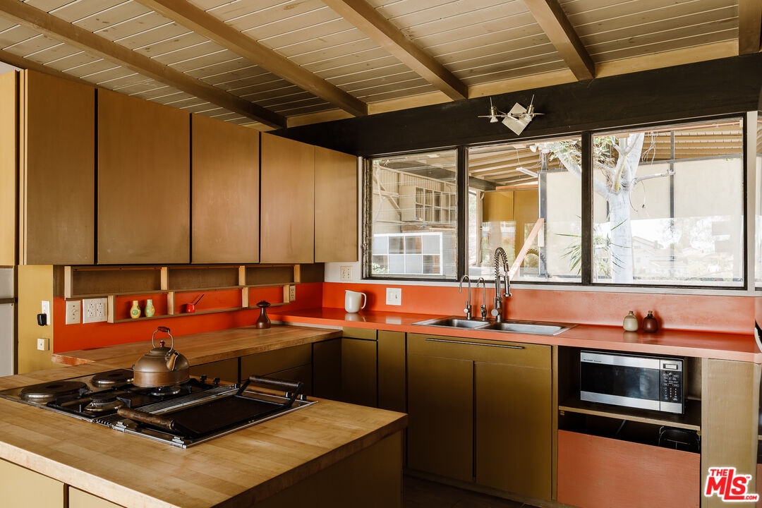 2 Seahurst Road Rolling Hills Estates, CA 90274 - Photo 25 of 54 a kitchen with a stove a sink and a microwave