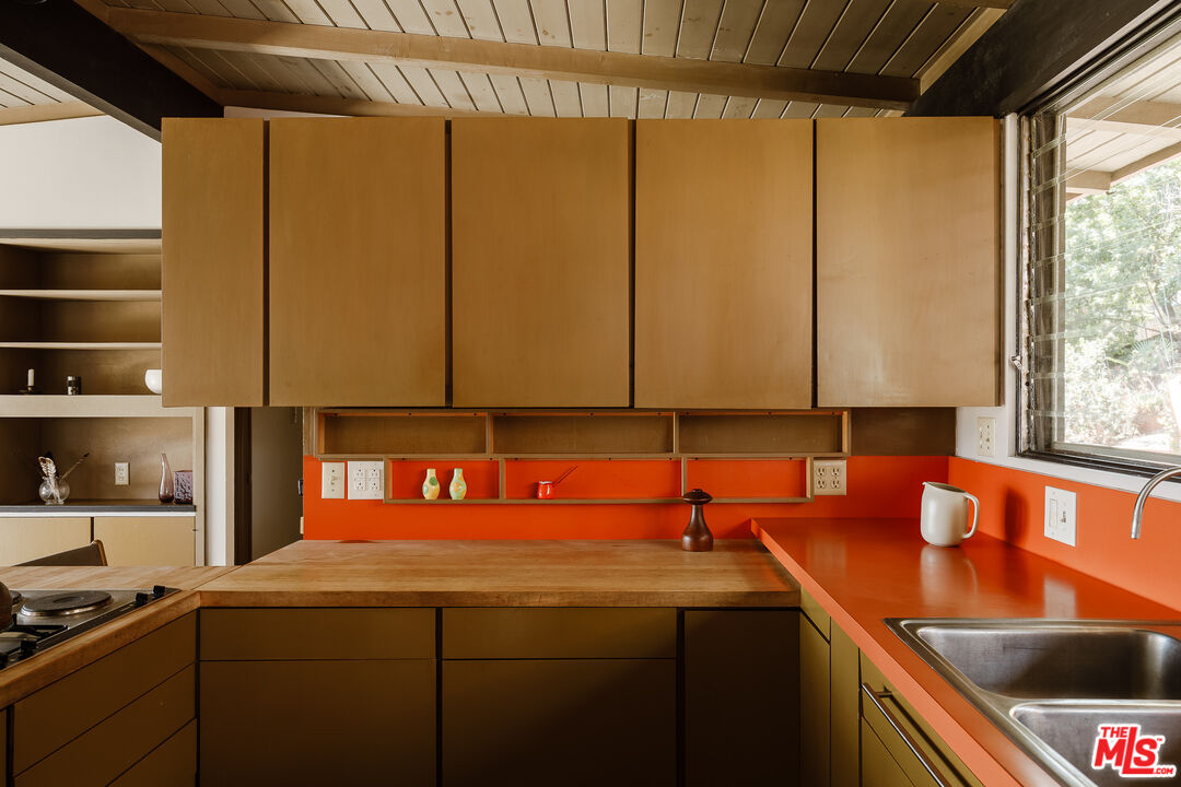 2 Seahurst Road Rolling Hills Estates, CA 90274 - Photo 27 of 54 a kitchen with stainless steel appliances granite countertop a sink a counter space and a window