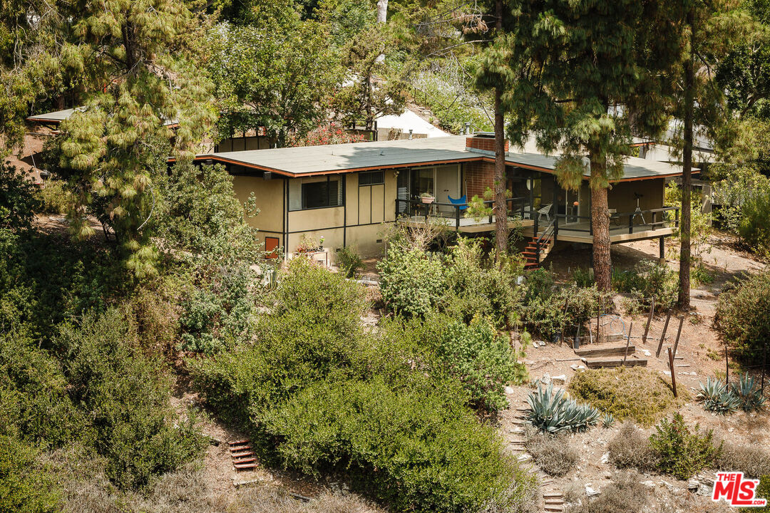 2 Seahurst Road Rolling Hills Estates, CA 90274 - Photo 51 of 54 a view of a white house with a yard and sitting area