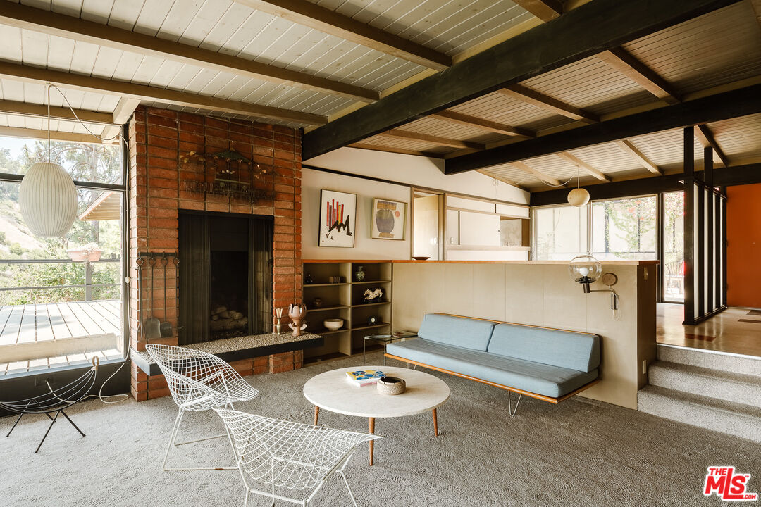 2 Seahurst Road Rolling Hills Estates, CA 90274 - Photo 9 of 54 a living room with furniture a fireplace and a table