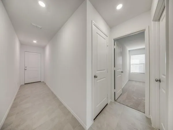 a view of a room with a hallway and toilet