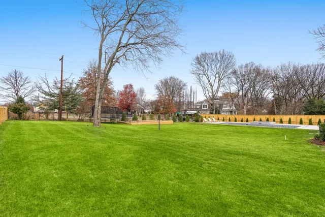 a dinning table and chairs in the garden