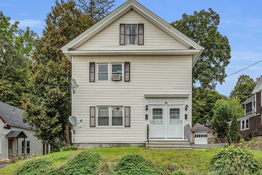 a front view of a house with a yard