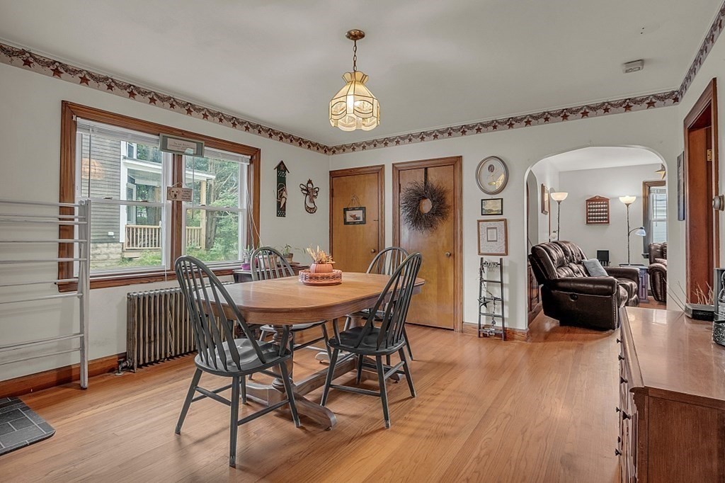 138 Cottage Street Athol, MA 01331 - Photo 11 of 42 a view of a dining room with furniture window and wooden floor