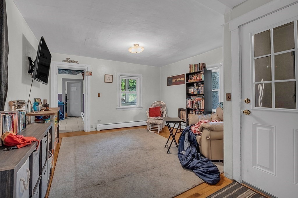 138 Cottage Street Athol, MA 01331 - Photo 20 of 42 a room with furniture a flat screen tv and a window