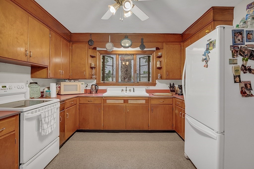138 Cottage Street Athol, MA 01331 - Photo 2 of 42 a kitchen with a sink stove and cabinets