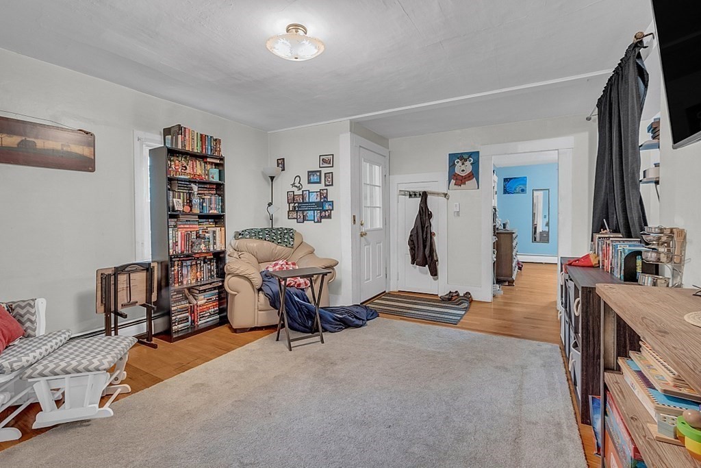 138 Cottage Street Athol, MA 01331 - Photo 22 of 42 a living room with furniture and a flat screen tv