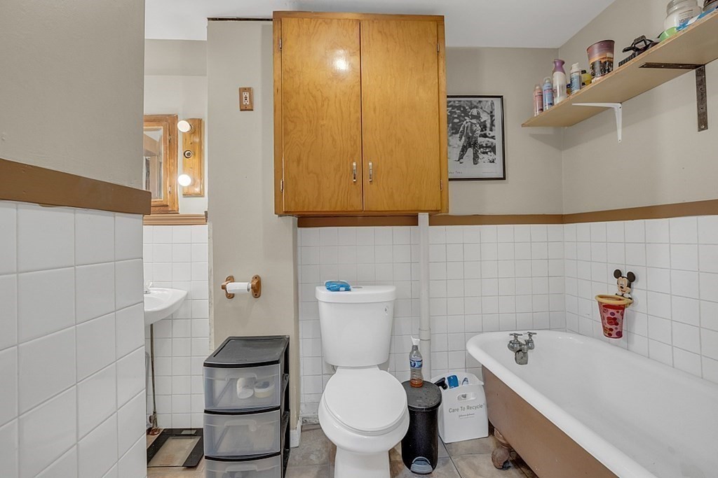 138 Cottage Street Athol, MA 01331 - Photo 23 of 42 a bathroom with a sink a toilet and shower