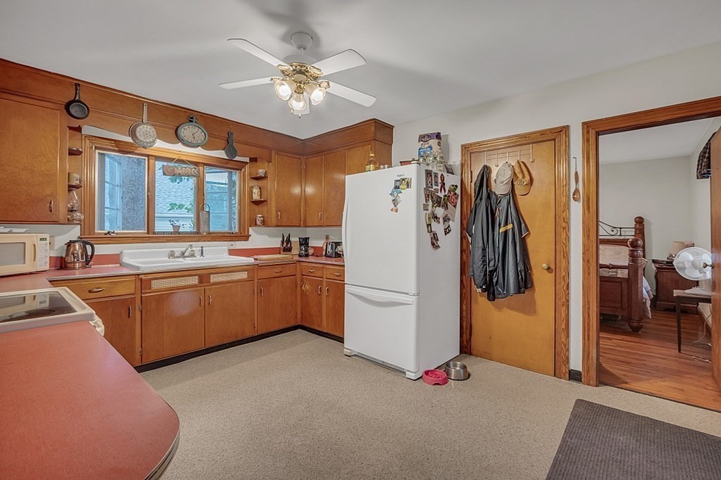 138 Cottage Street Athol, MA 01331 - Photo 3 of 42 a kitchen with refrigerator cabinets and furniture