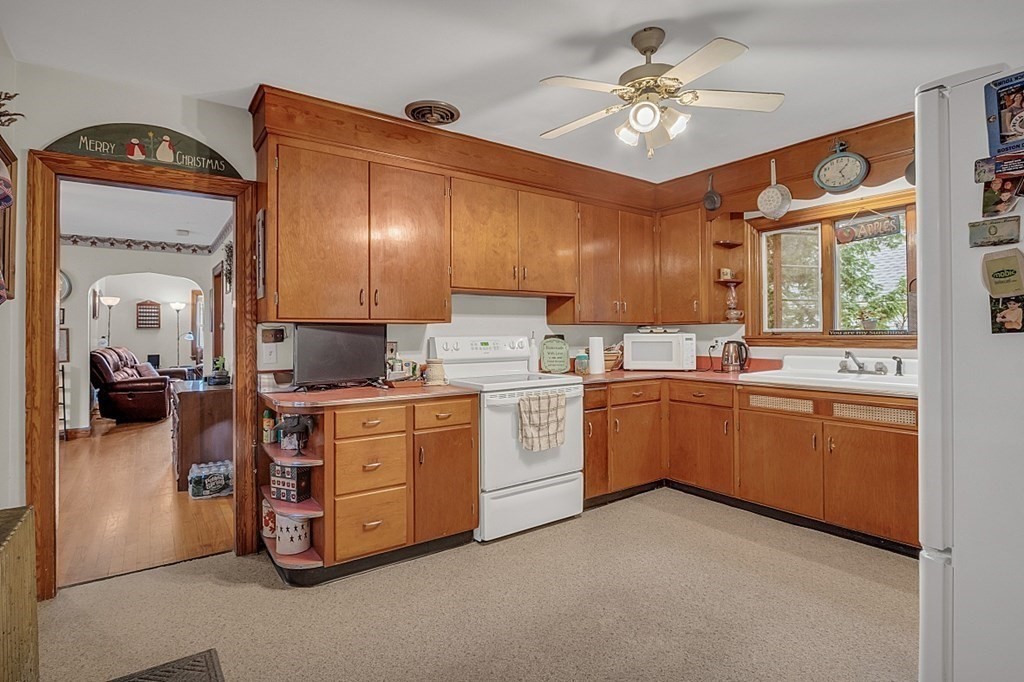 138 Cottage Street Athol, MA 01331 - Photo 4 of 42 a kitchen with cabinets a sink and appliances