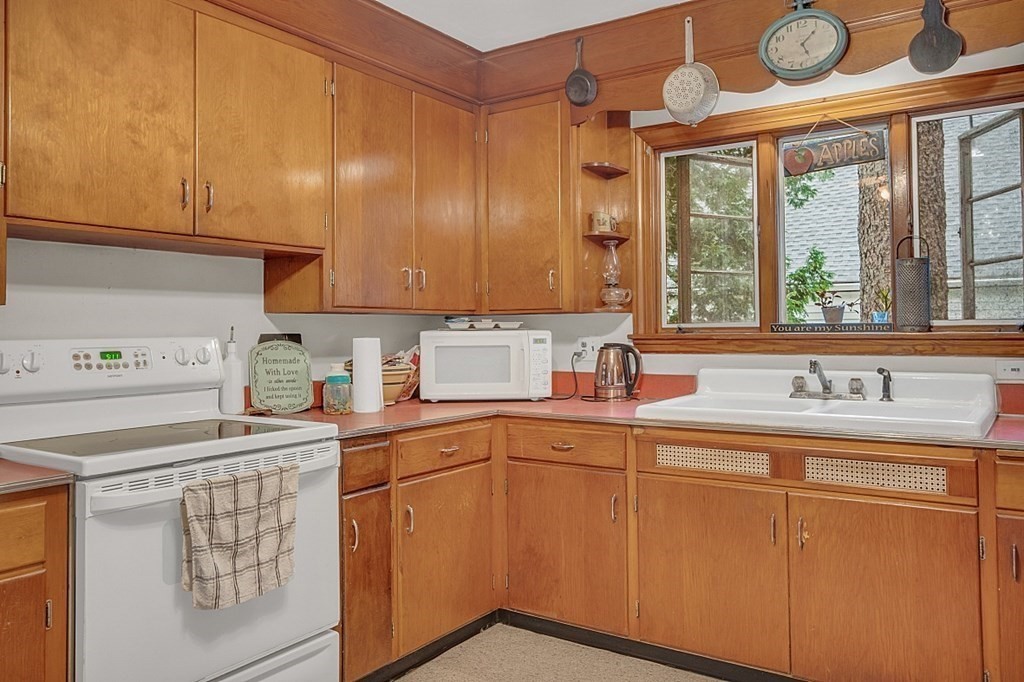 138 Cottage Street Athol, MA 01331 - Photo 5 of 42 a kitchen with sink cabinets and window