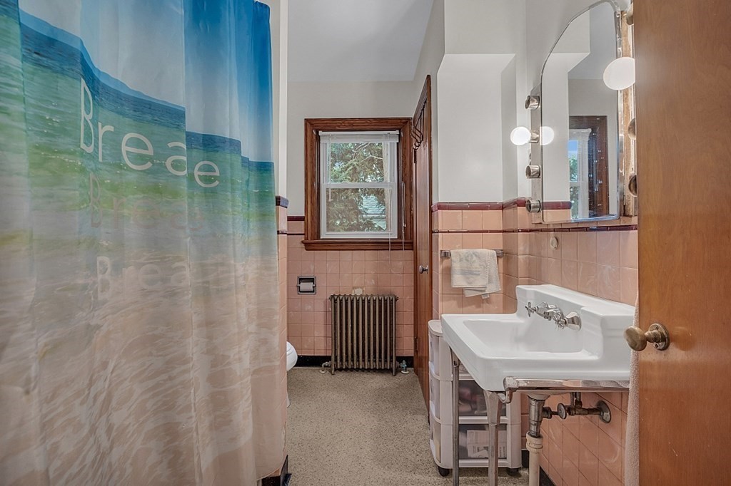 138 Cottage Street Athol, MA 01331 - Photo 7 of 42 a bathroom with a sink a mirror and a shower