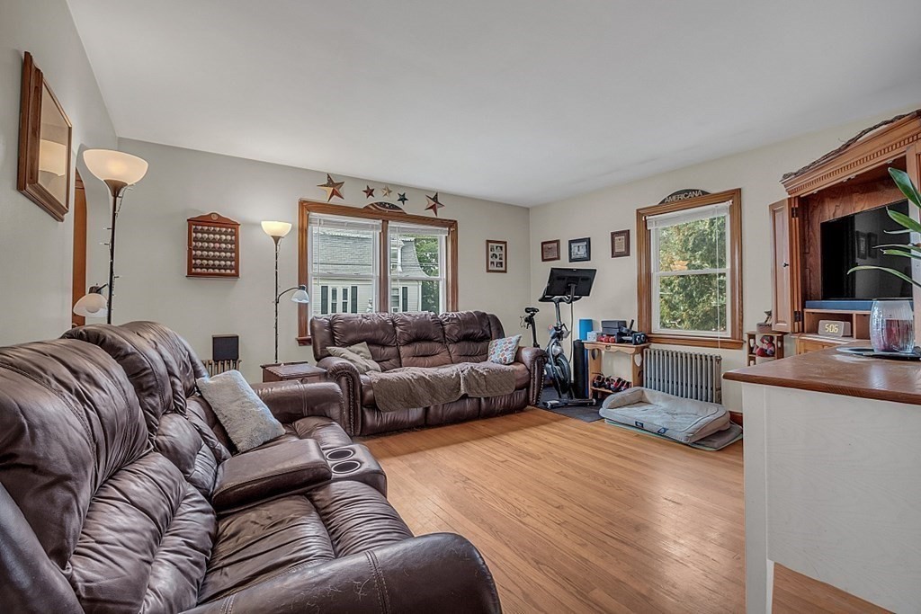 138 Cottage Street Athol, MA 01331 - Photo 8 of 42 a living room with furniture and a flat screen tv