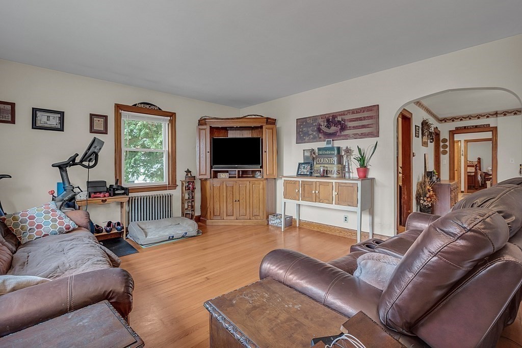 138 Cottage Street Athol, MA 01331 - Photo 9 of 42 a living room with furniture and a flat screen tv