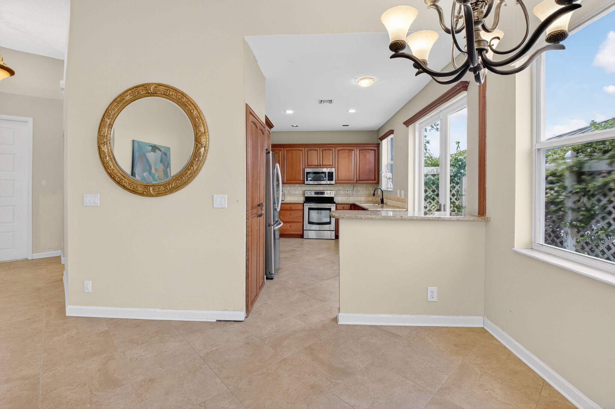 4101 Northwest 2nd Lane Delray Beach, FL 33445 - Photo 11 of 47 a view of a kitchen with a sink and a large window