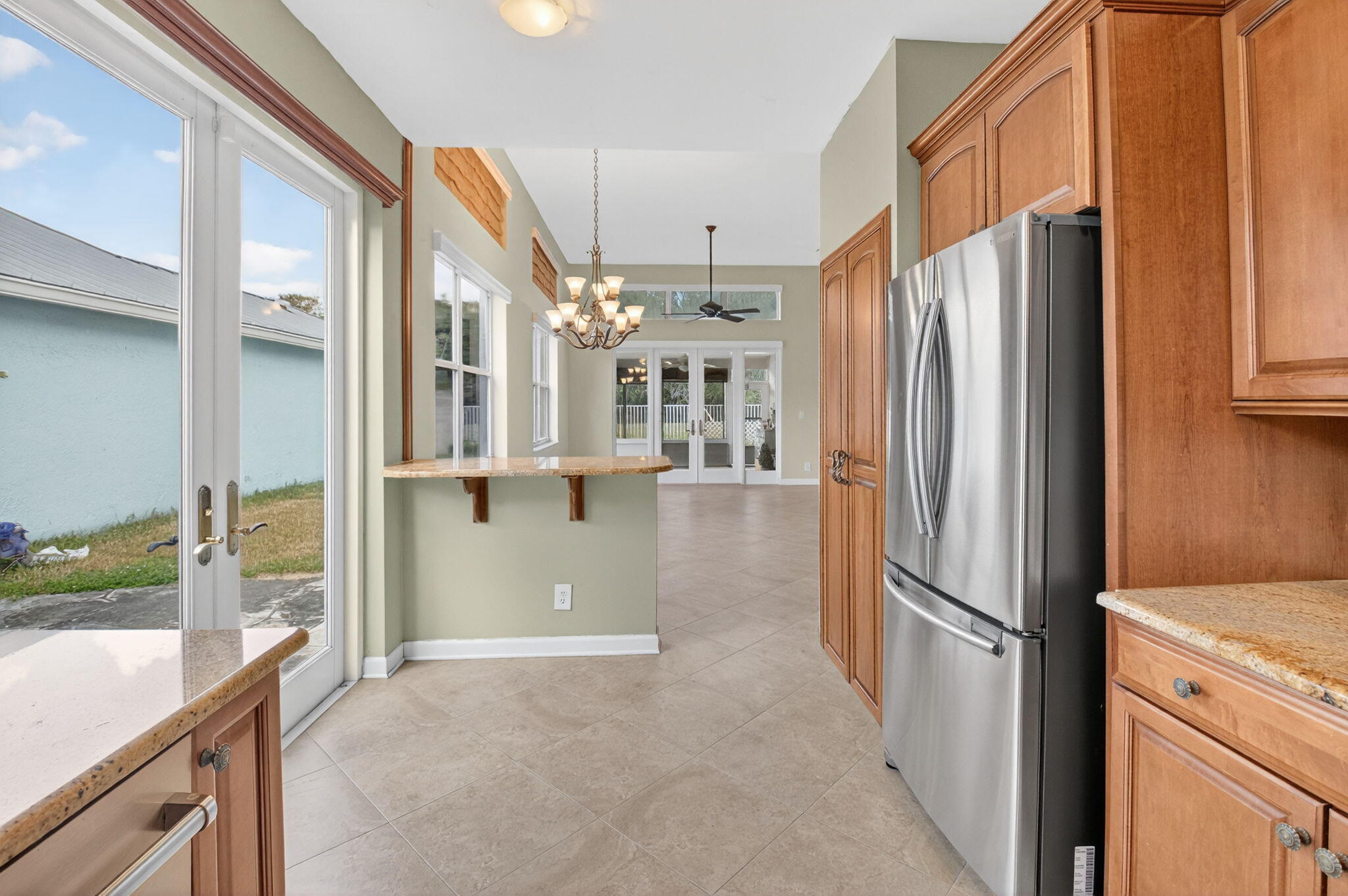 4101 Northwest 2nd Lane Delray Beach, FL 33445 - Photo 15 of 47 a view of large kitchen with a refrigerator cabinets and a wooden floor