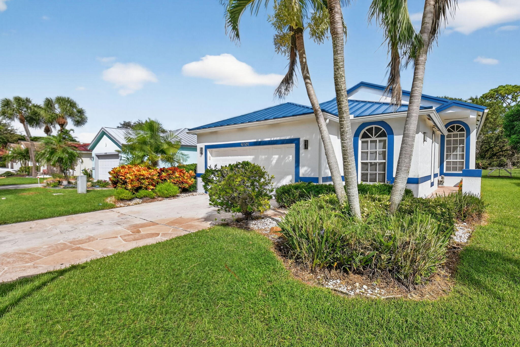 4101 Northwest 2nd Lane Delray Beach, FL 33445 - Photo 2 of 47 a front view of a house with garden