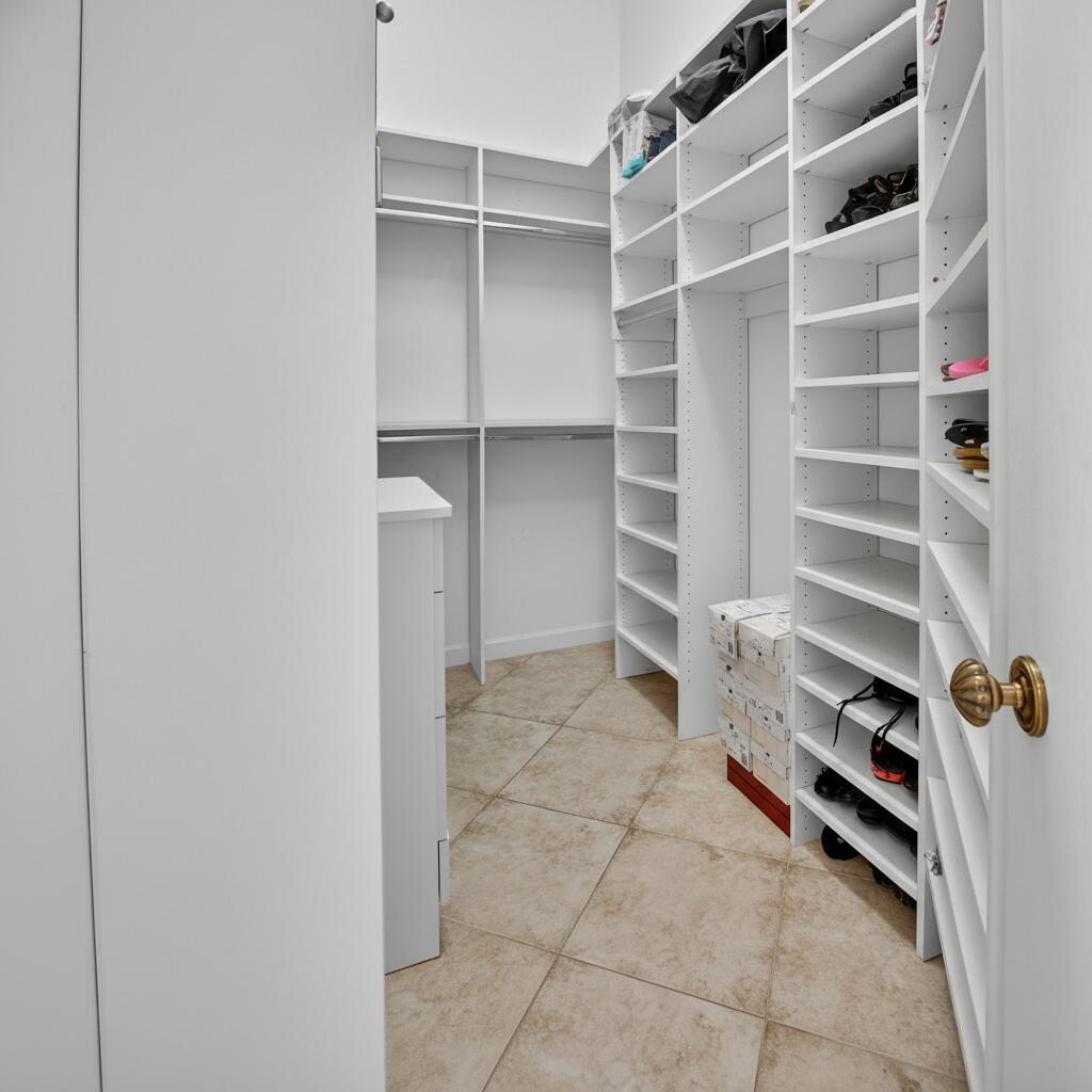 4101 Northwest 2nd Lane Delray Beach, FL 33445 - Photo 22 of 47 a view of walk in closet with empty racks