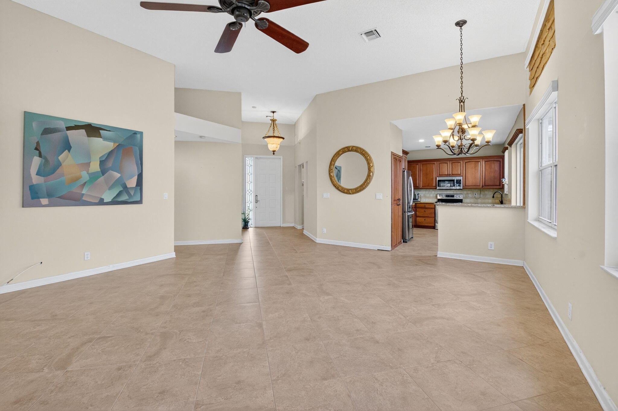 4101 Northwest 2nd Lane Delray Beach, FL 33445 - Photo 10 of 47 a view of a room with a hanging light and kitchen