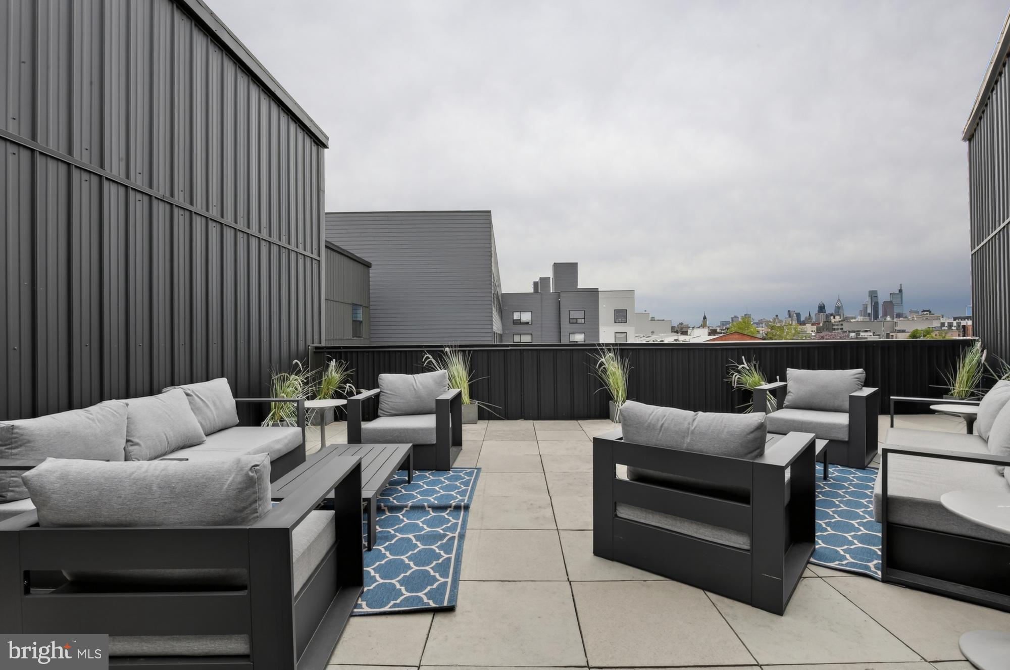 1924 North Front Street, Unit 206 Philadelphia, PA 19122 - Photo 18 of 30 a rooftop view with seating space