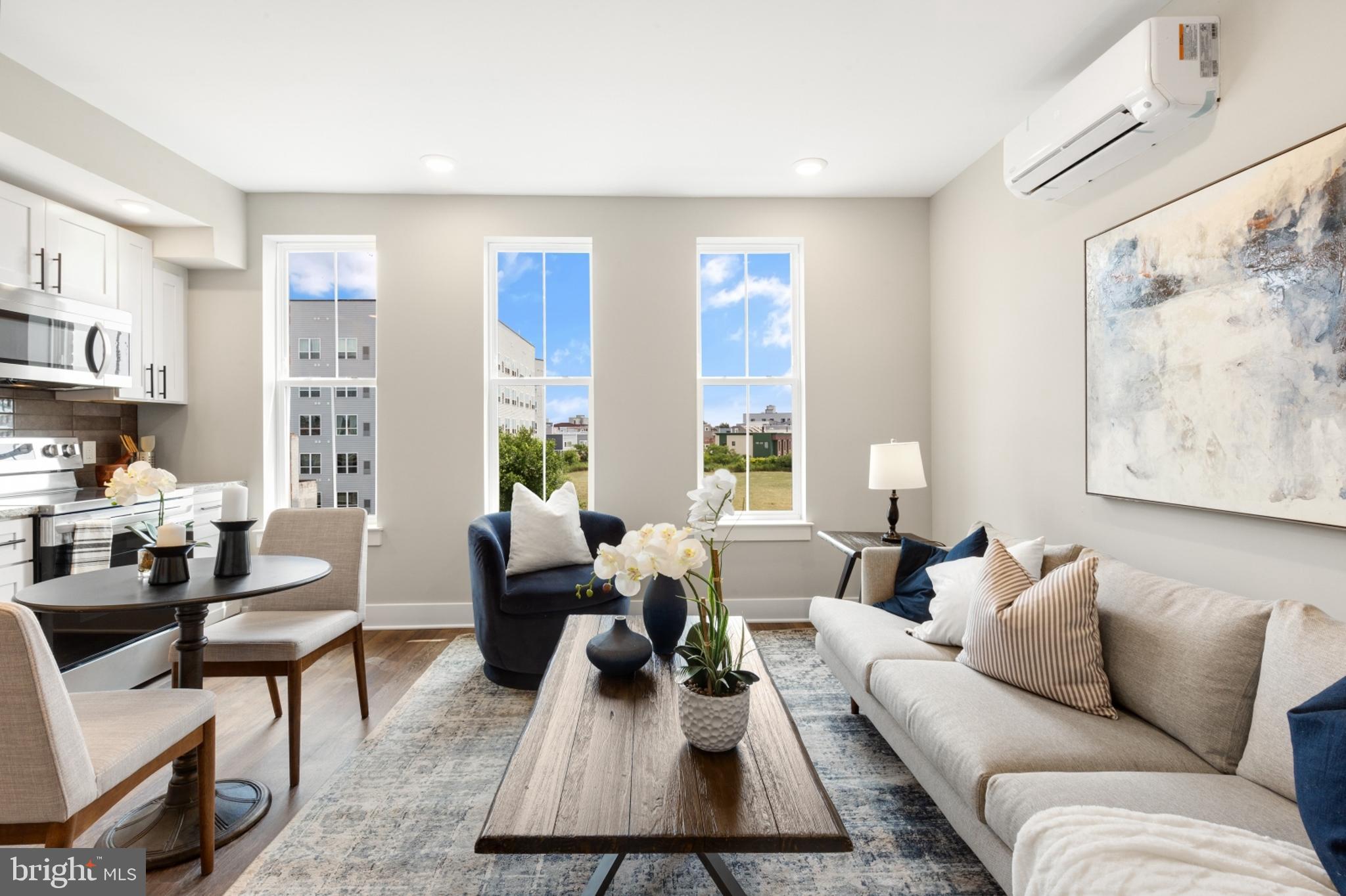 1924 North Front Street, Unit 206 Philadelphia, PA 19122 - Photo 4 of 30 a living room with furniture wooden floor and a large window