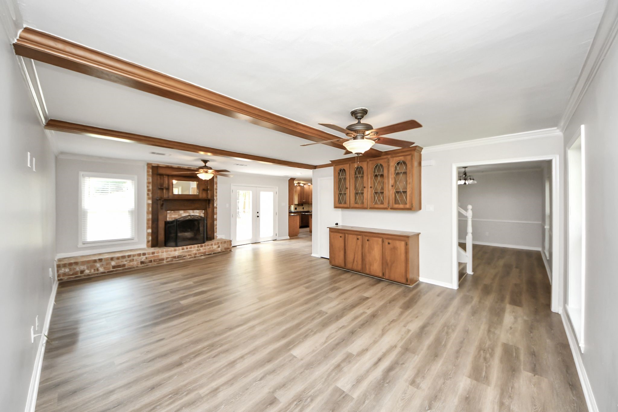 3923 Cypress Lake Drive Spring, TX 77388 - Photo 11 of 41 Large living room with a cozy fireplace and built-ins, offering the perfect blend of comfort and character.