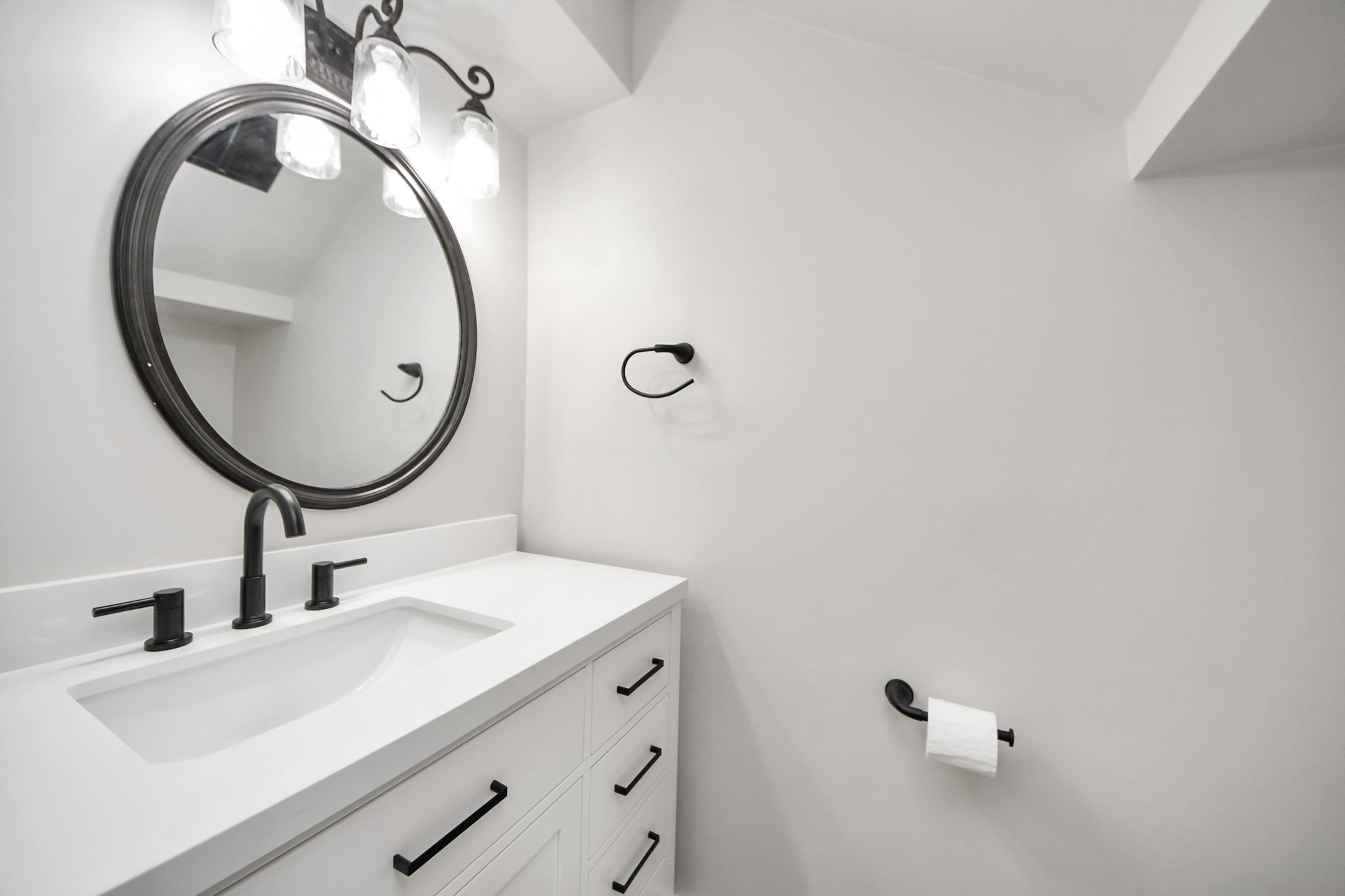3923 Cypress Lake Drive Spring, TX 77388 - Photo 17 of 41 Downstairs half bath featuring brand new cabinetry and quartz countertops for a fresh modern finish.