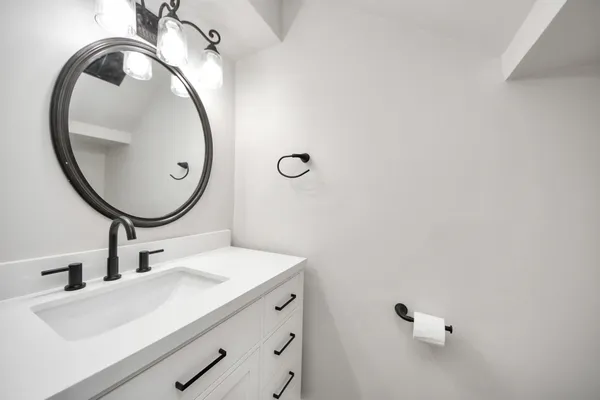 a bathroom with a sink and a mirror